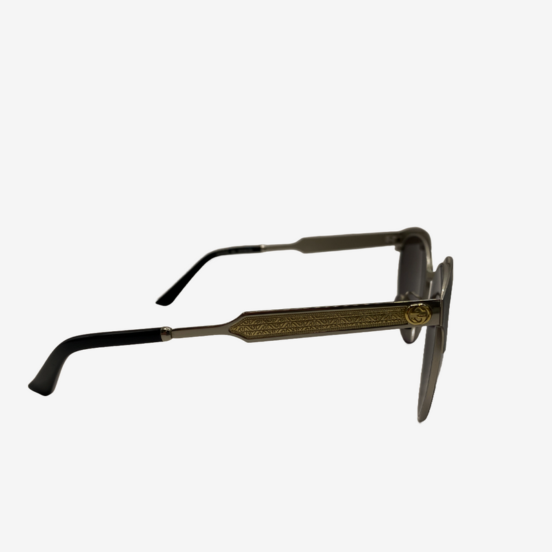 Gucci unisex sunglasses with silver and gold engraved sides