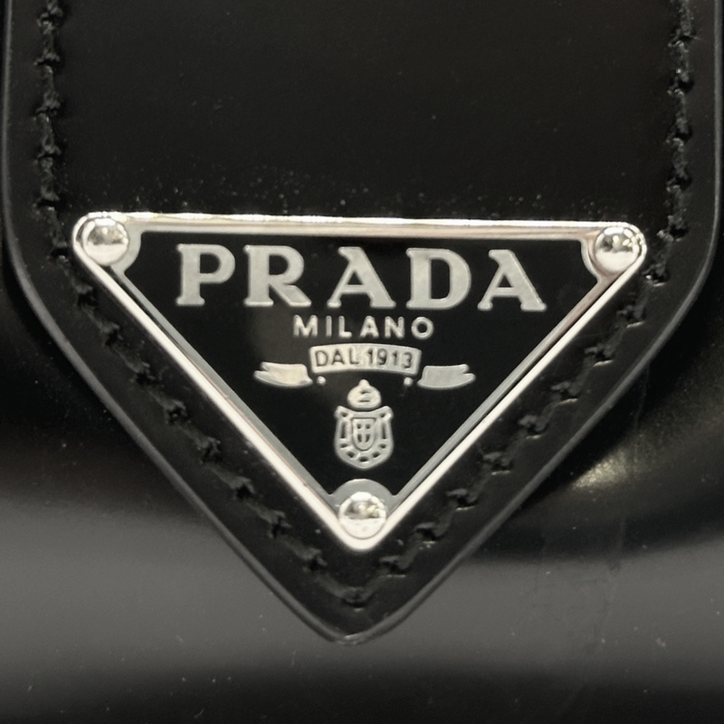 Prada black patent leather Supernova handbag with logo details on the sides