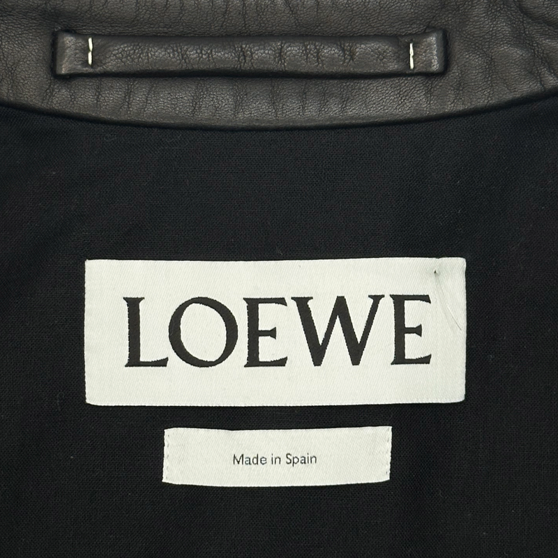 Loewe women's black and white leather biker jacket with striped knitted sleeves