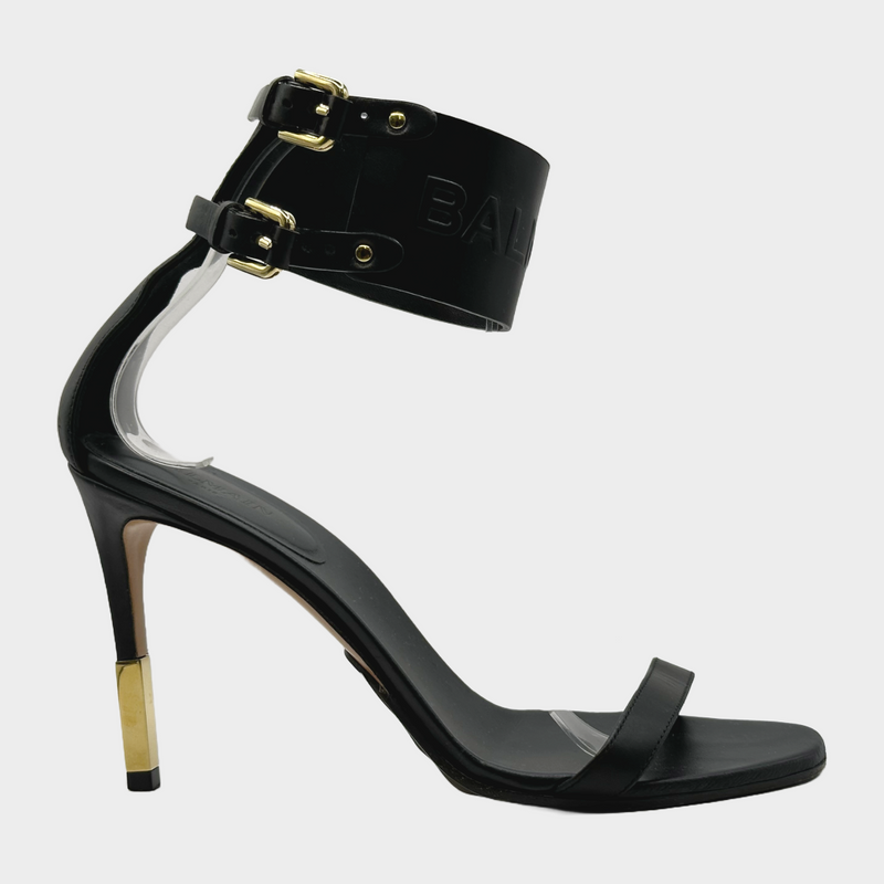 Balmain black leather ankle logo strap heels with gold tone hardware
