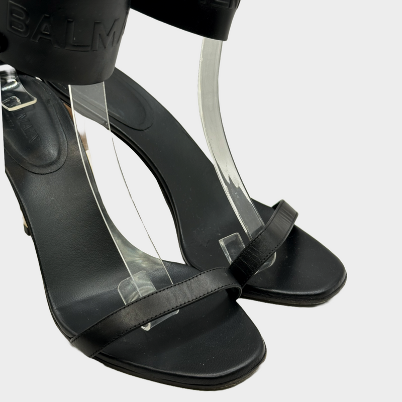 Balmain black leather ankle logo strap heels with gold tone hardware