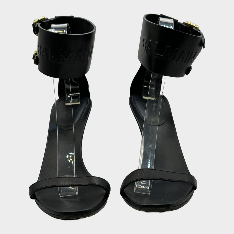 Balmain black leather ankle logo strap heels with gold tone hardware
