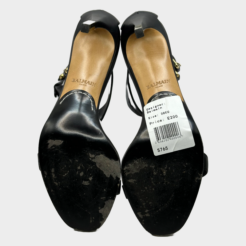 Balmain black leather ankle logo strap heels with gold tone hardware