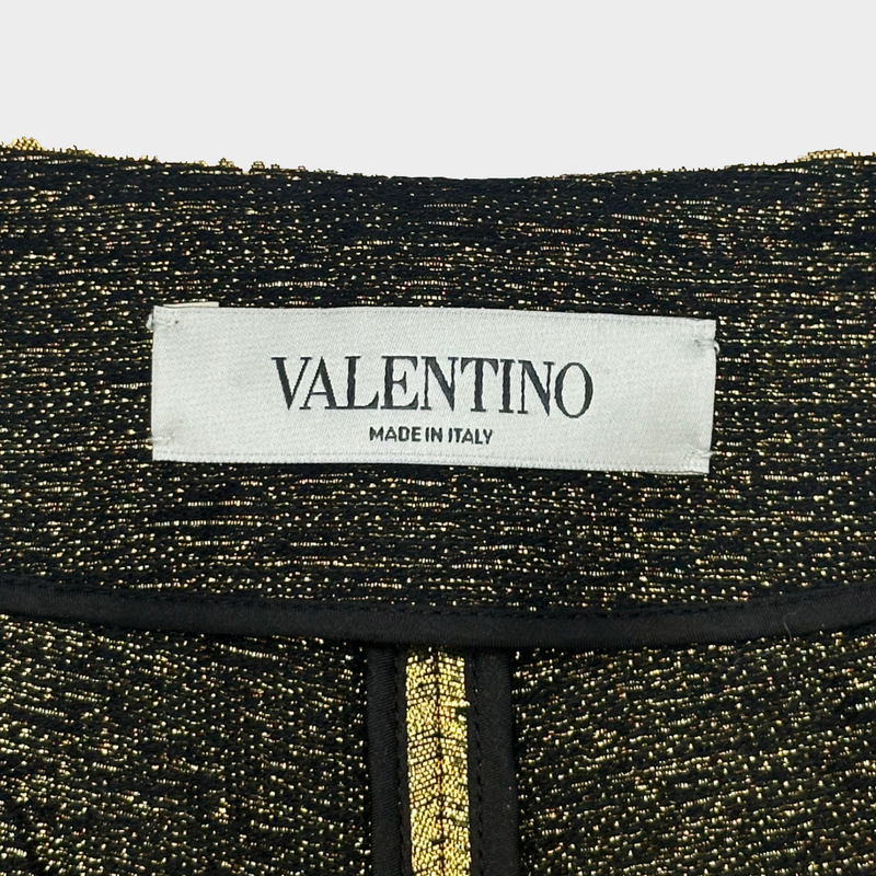 Valentino gold metallic shorts with V detail at the front