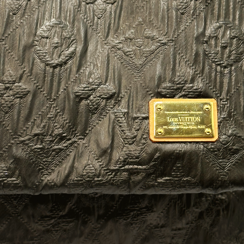 Louis Vuitton women's brown embossed monogram textured leather clutch