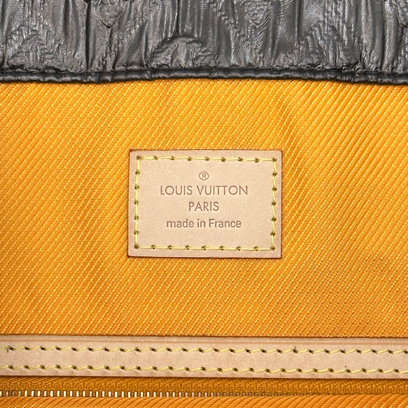 Louis Vuitton women's brown embossed monogram textured leather clutch