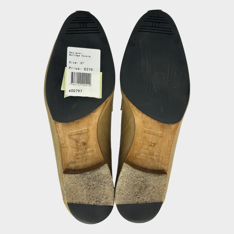 Hermes women's beige leather loafers with silver tone H buckle