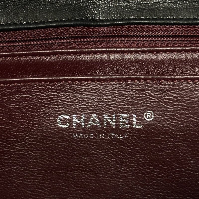 Chanel women's black lambskin leather jumbo classic flap handbag