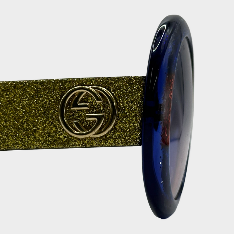 Gucci women's red and blue glittered round sunglasses with gold glittered side