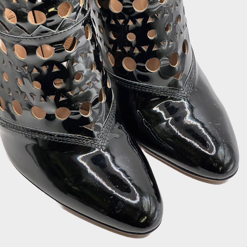 ALAÏA black patent leather laser cut ankle boots