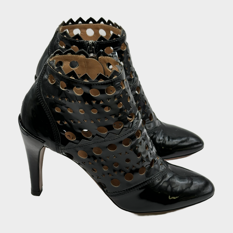 ALAÏA black patent leather laser cut ankle boots