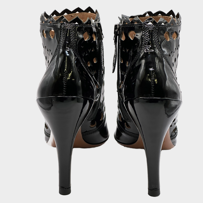 ALAÏA black patent leather laser cut ankle boots