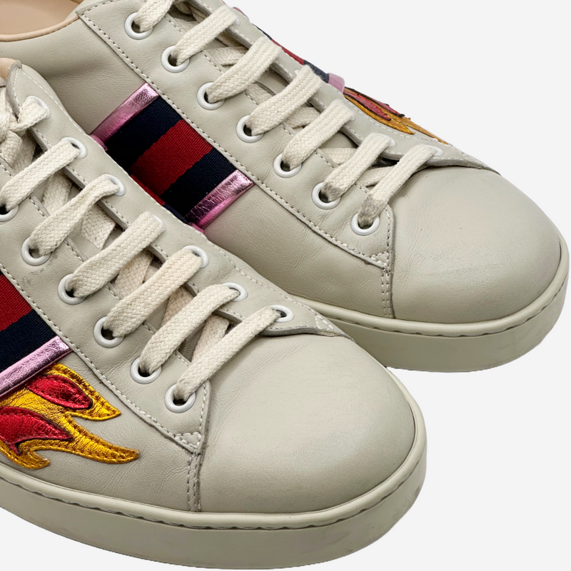 Gucci men's beige leather sneakers with metallic flames embroidery and stripes details