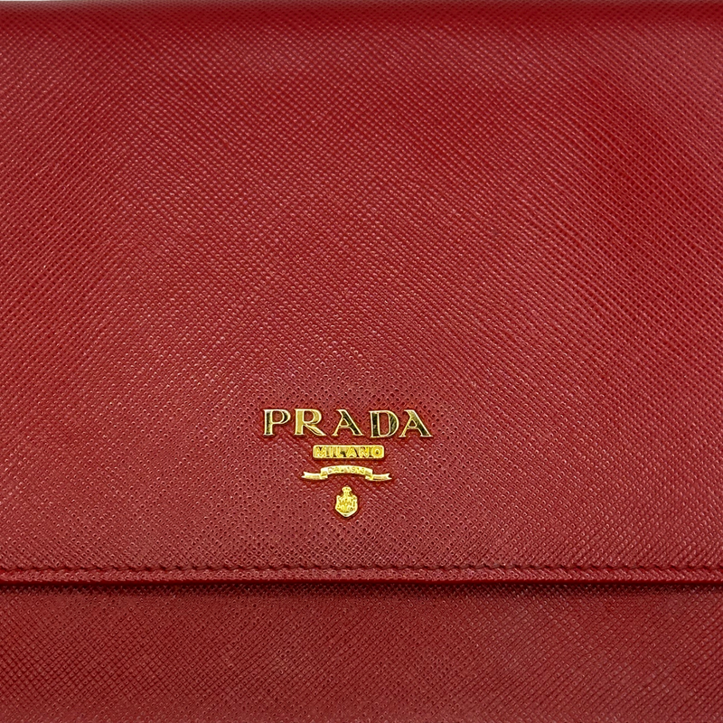 Prada red saffiano leather flap crossbody bag