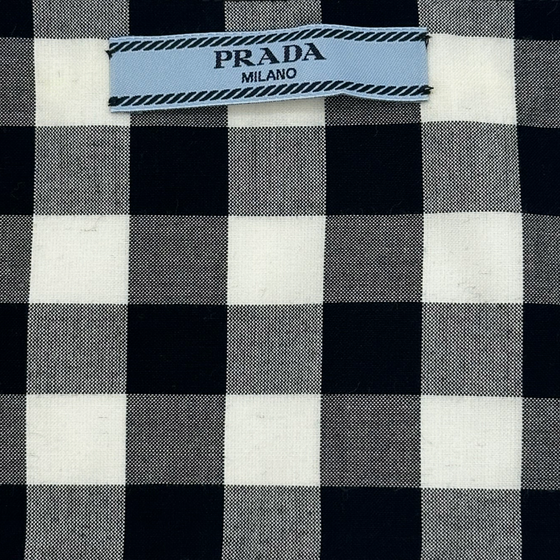 Prada women's black and white checkered set of top and trousers with yellow logo detail