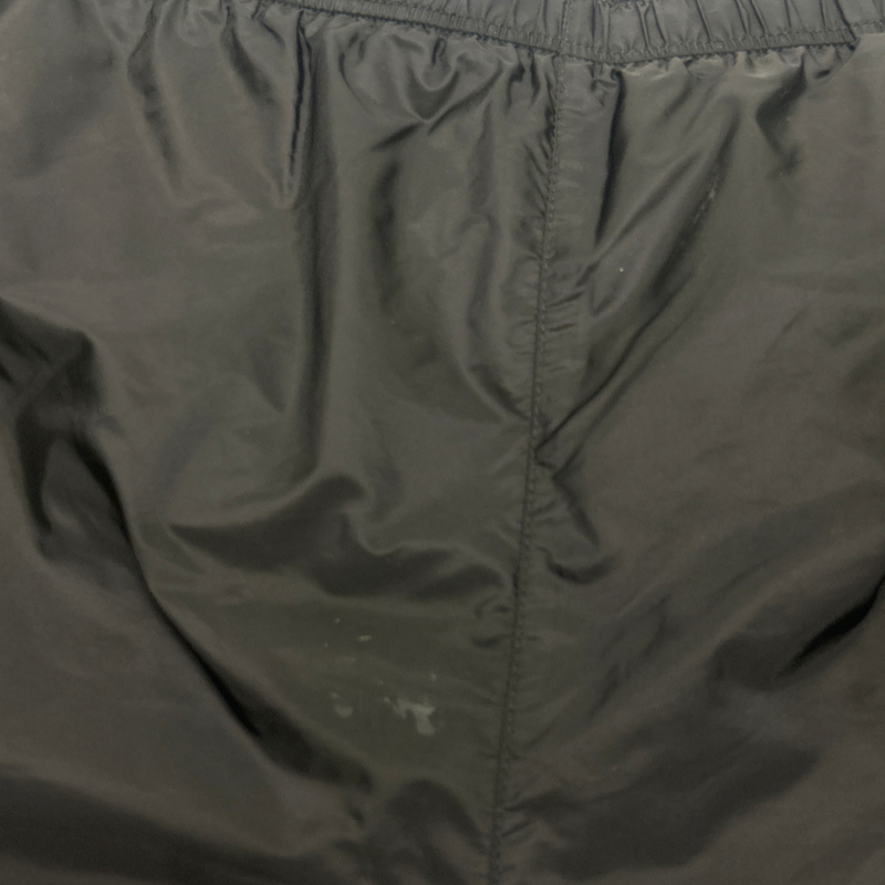 Prada men's black swimming trunks with triangle logo detail