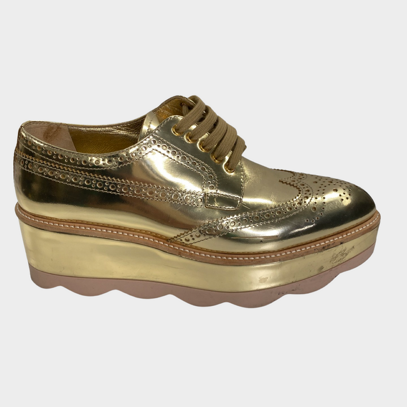 Prada women's gold patent leather platform shoes