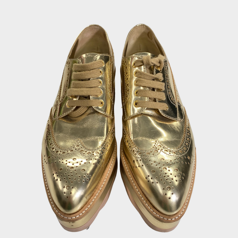 Prada women's gold patent leather platform shoes