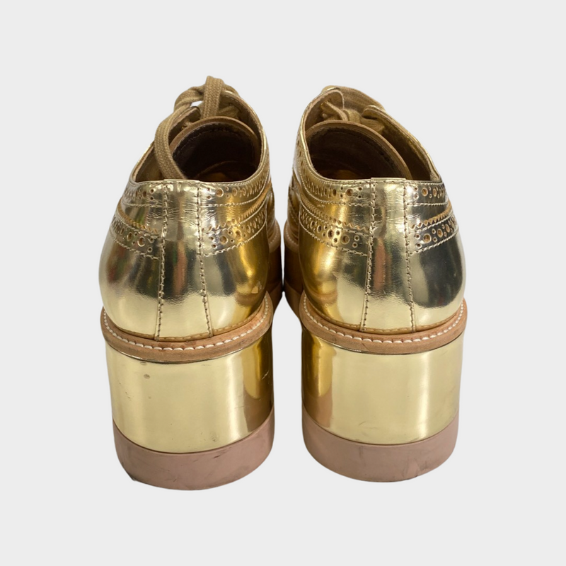 Prada women's gold patent leather platform shoes