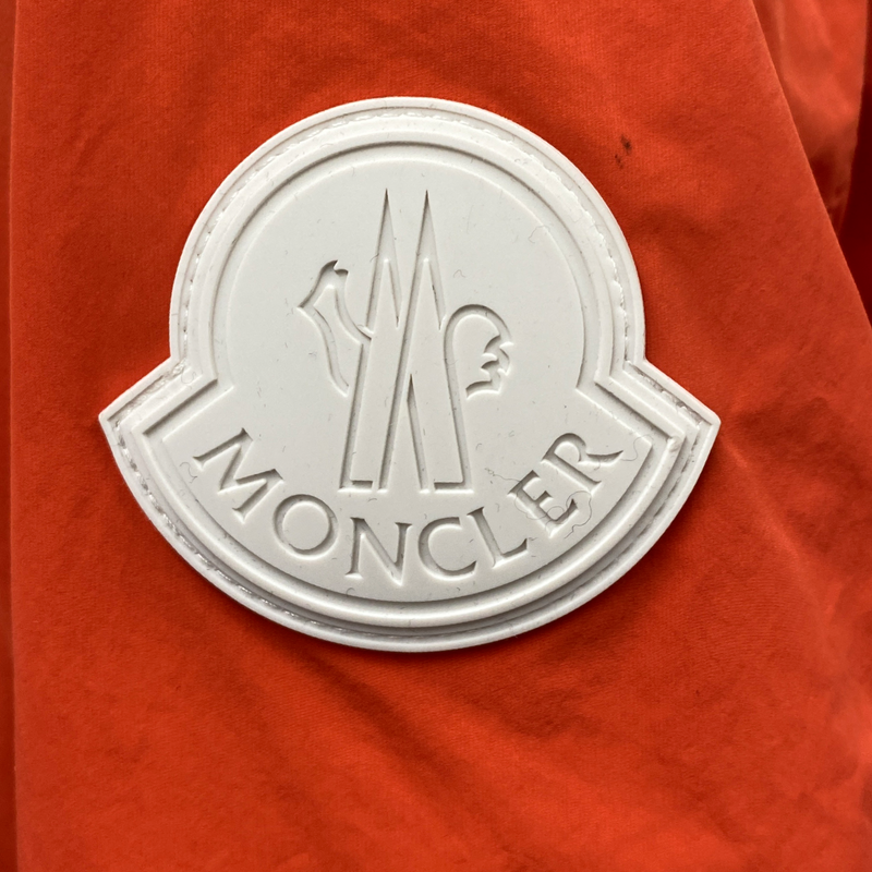 Moncler men's orange rain jacket with front zipper
