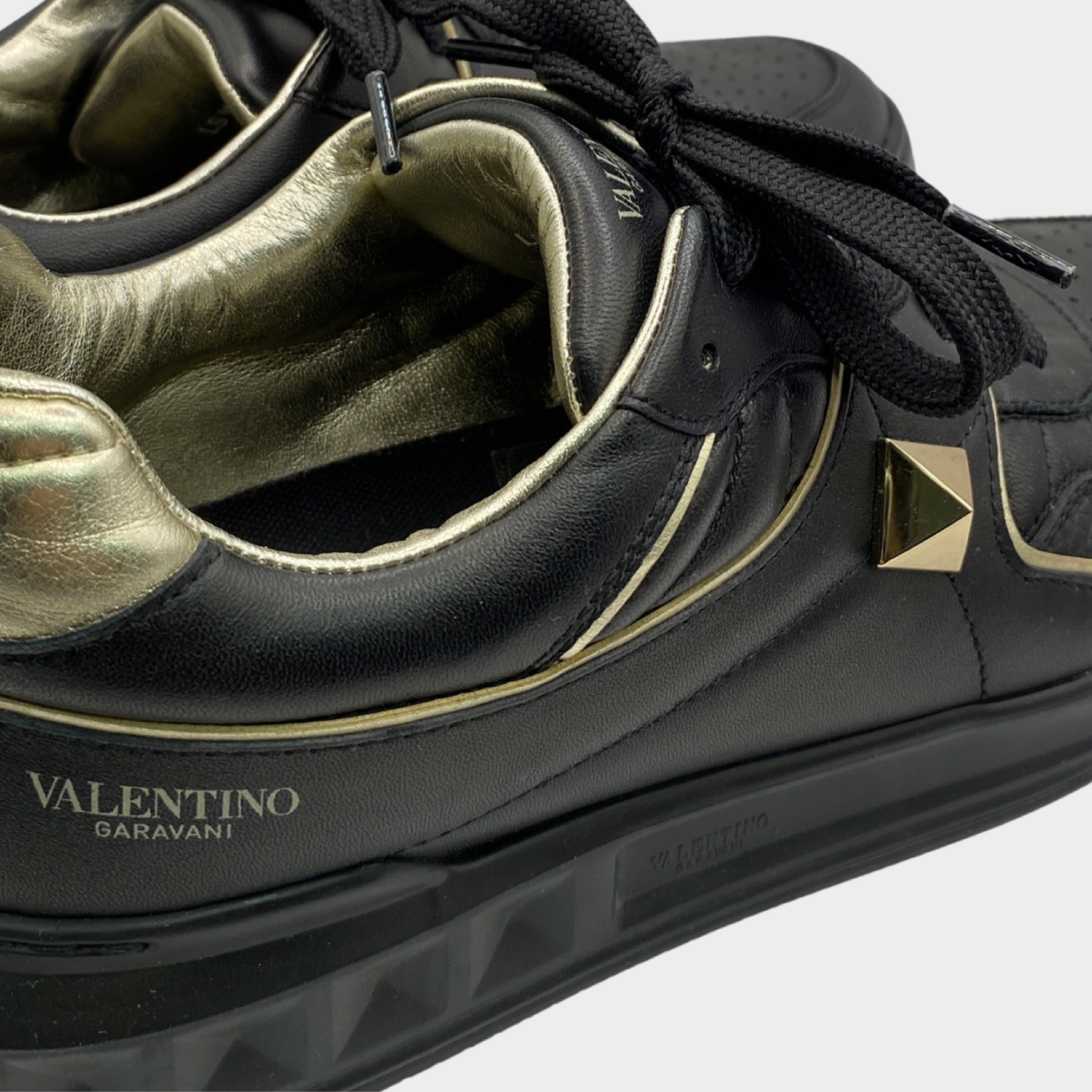 Valentino Garavani women s black gold stud trainers Loop Generation