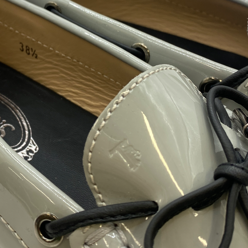 Tod's women's grey patent leather moccasins