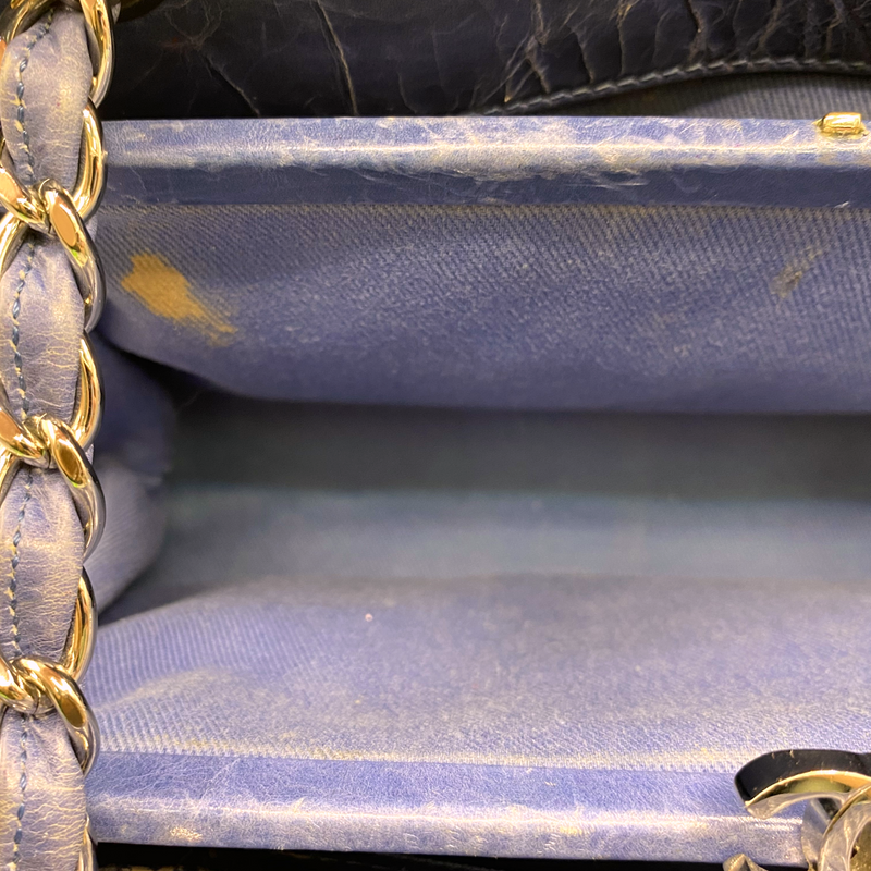 Chanel women's blue quilted leather moon-shaped vintage handbag
