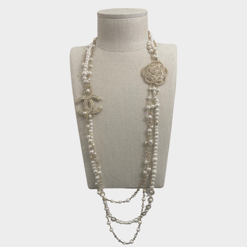 Chanel women's triple layer gold pearl necklace with diamante CC logo and Camelia flower