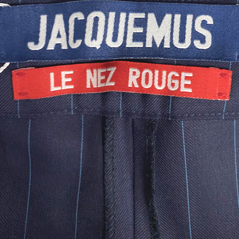 Jacquemus women's navy pinstripe wool trousers with ecru peplum detail