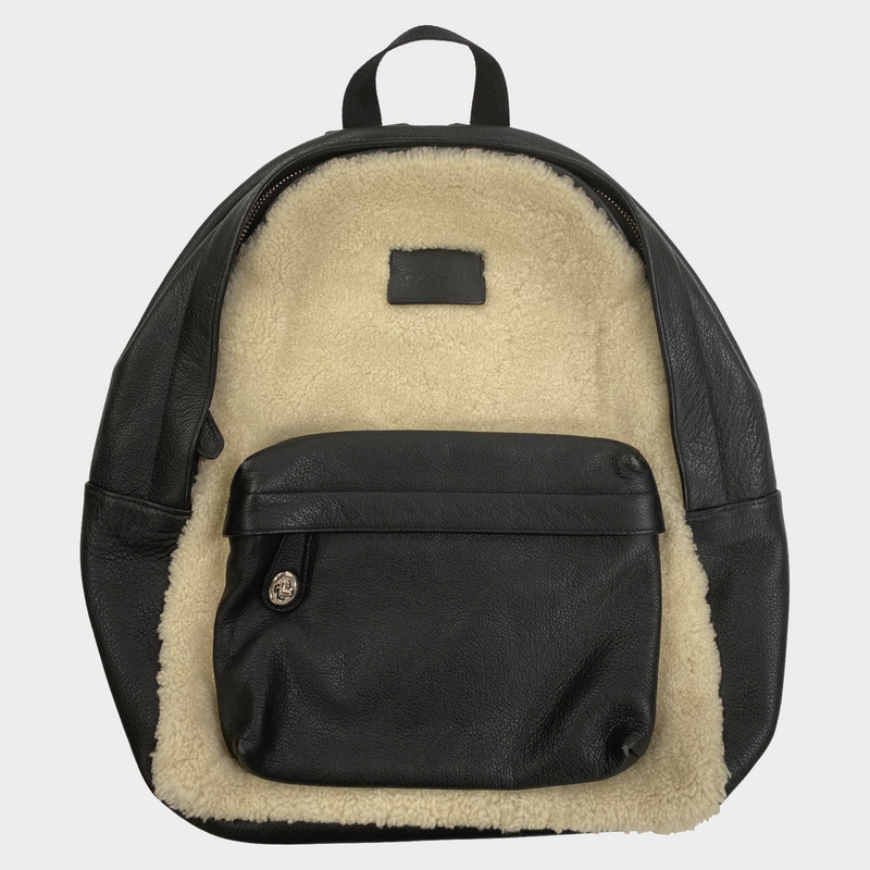 Coach men's black leather and cream fur backpack