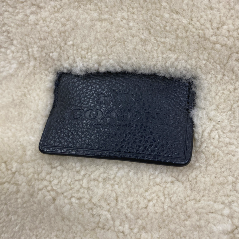 Coach men's black leather and cream fur backpack