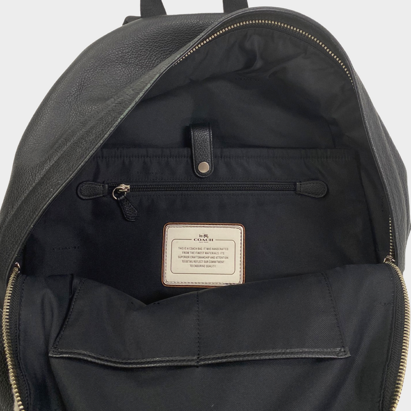 Coach men's black leather and cream fur backpack