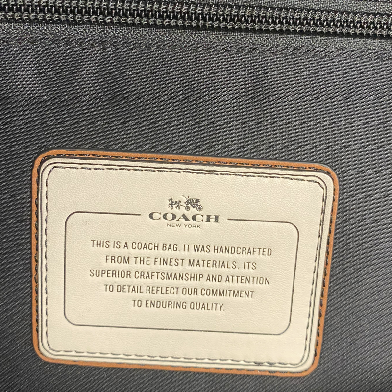 Coach men's black leather and cream fur backpack