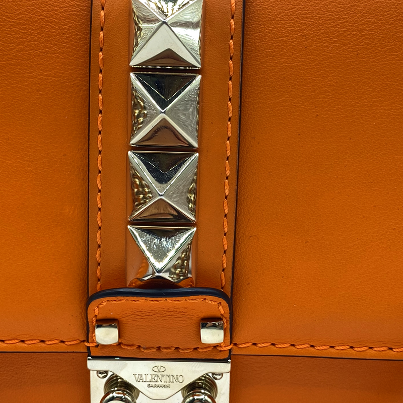 Valentino women's neon orange leather rockstud bag