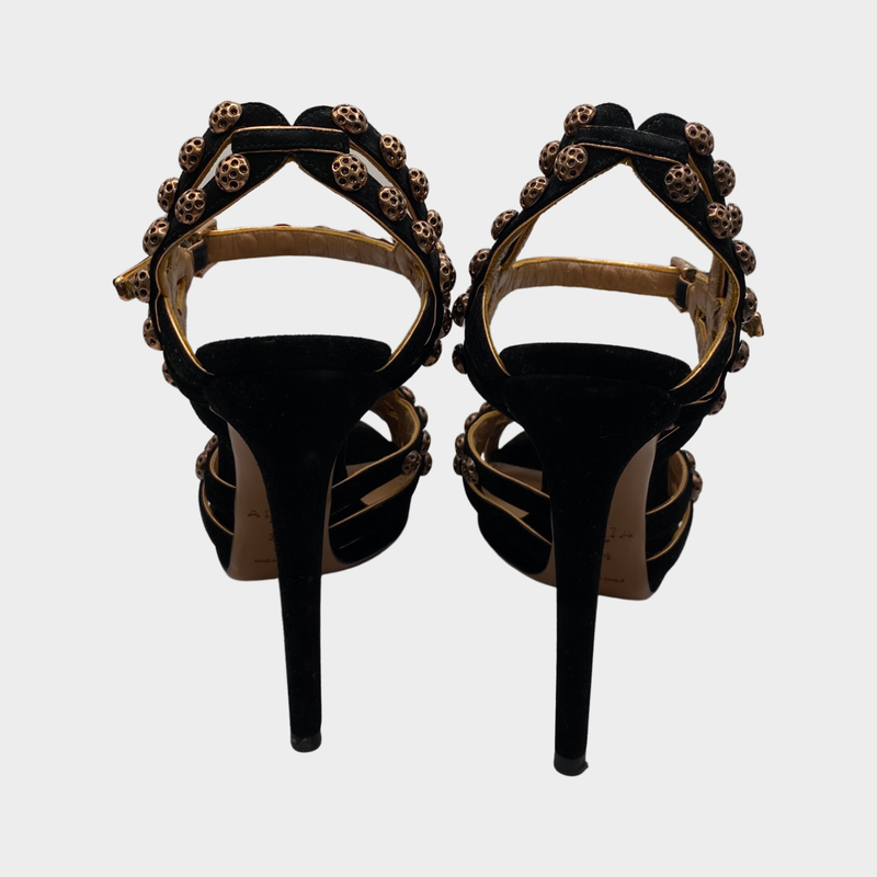 ALAÏA black suede heels with bronze studs