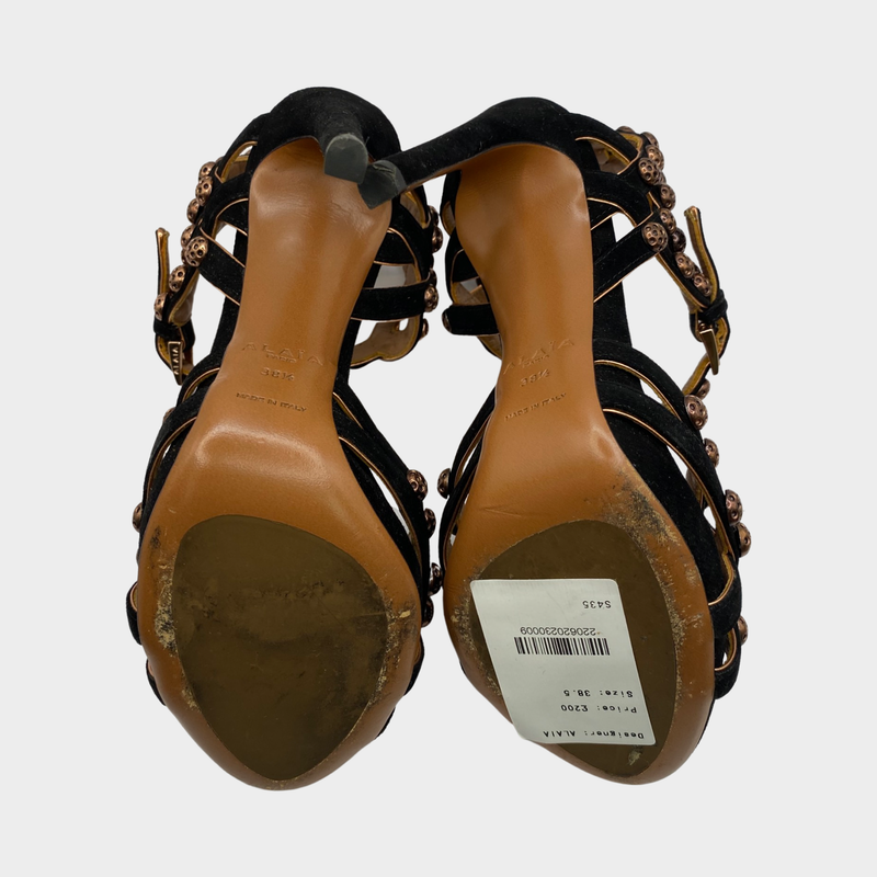 ALAÏA black suede heels with bronze studs