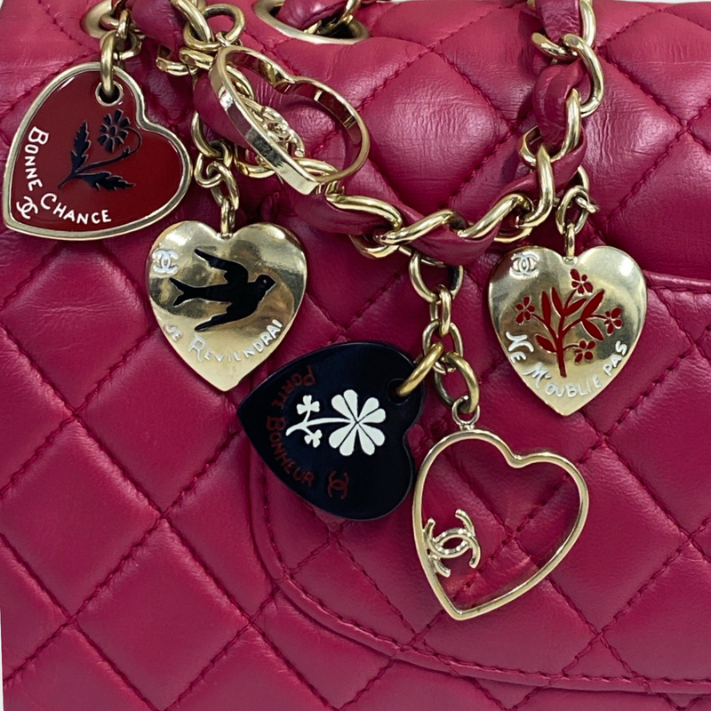 Chanel women's raspberry leather quilted flap bag with metal heart charms