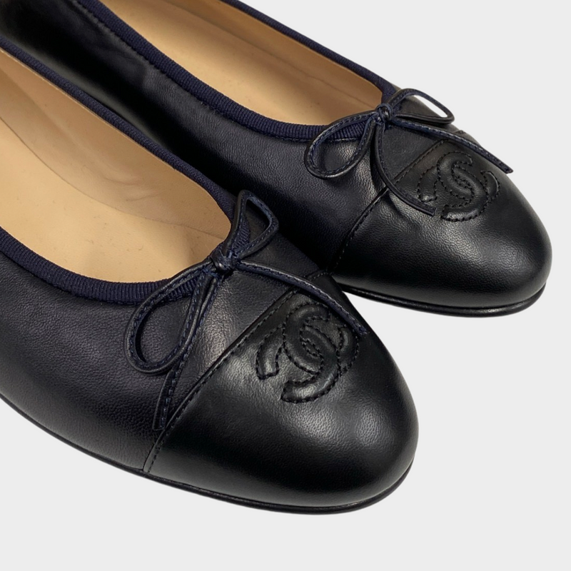 Chanel women's black leather flats with navy borders