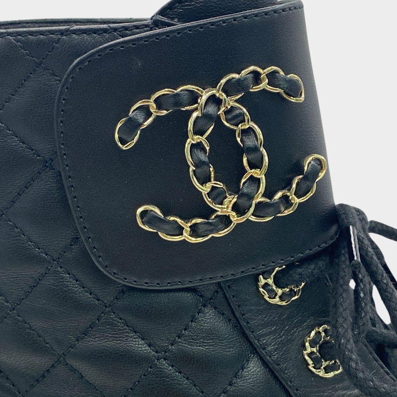 Chanel women's black CC quilted boots with flap