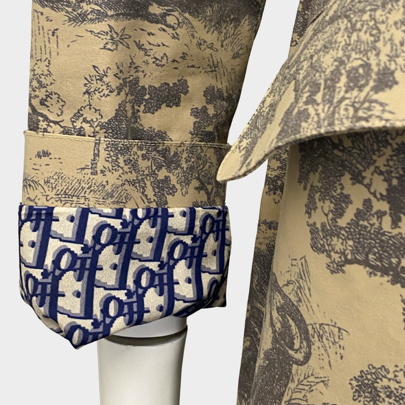 Christian Dior women's beige 'Dioriviera' Motif Toile De Jouy print trench coat with monogram oblique accents
