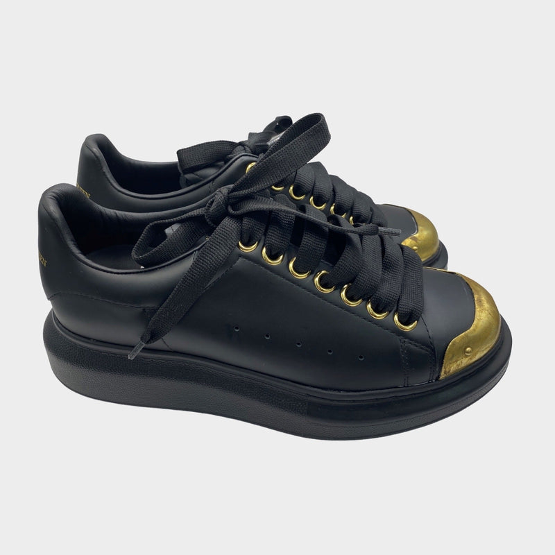 Alexander Mcqueen women's black leather raised-sole trainers with gold accents