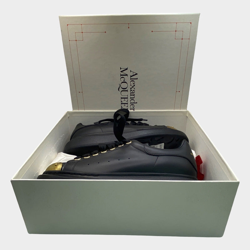 Alexander Mcqueen women's black leather raised-sole trainers with gold accents