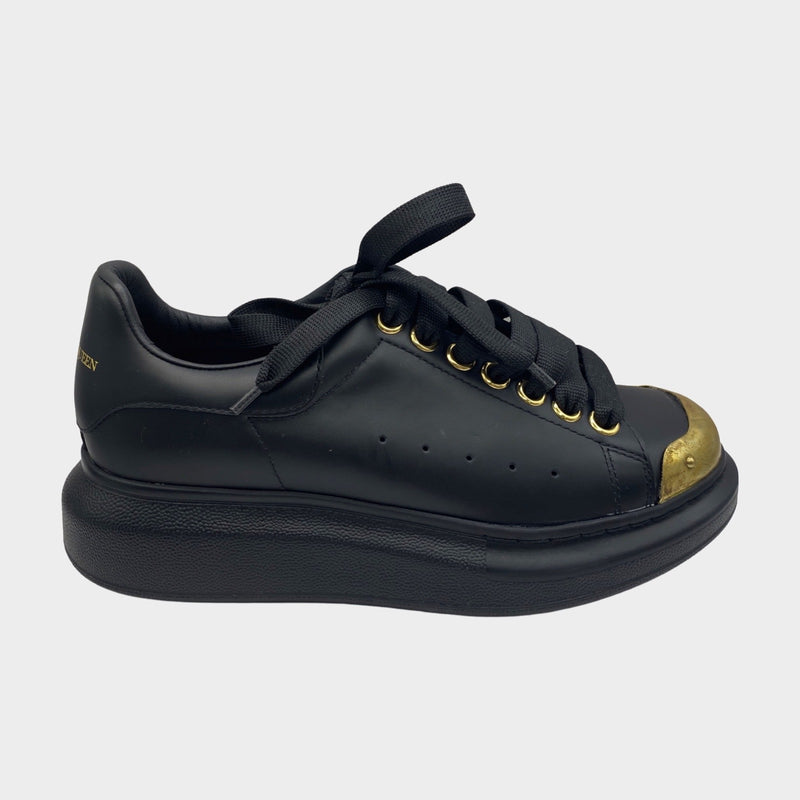 Alexander Mcqueen women's black leather raised-sole trainers with gold accents