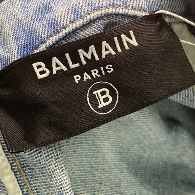 Balmain women's light blue denim jacket with gold accents