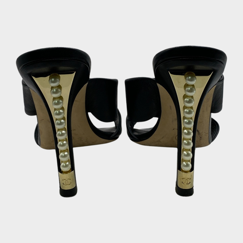 Chanel black leather mules with pearl detail