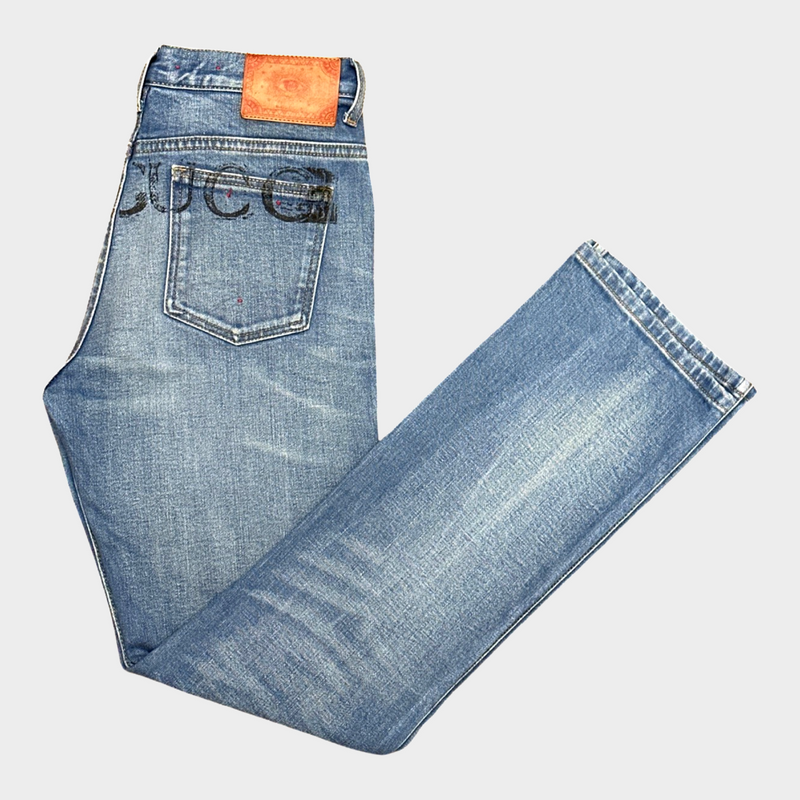 GUCCI women's blue distressed jeans with logo detail at the back