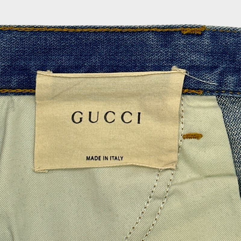 GUCCI women's blue distressed jeans with logo detail at the back