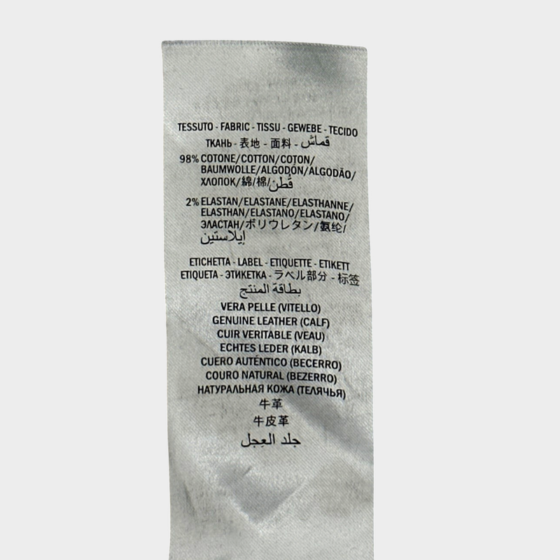 GUCCI women's blue distressed jeans with logo detail at the back