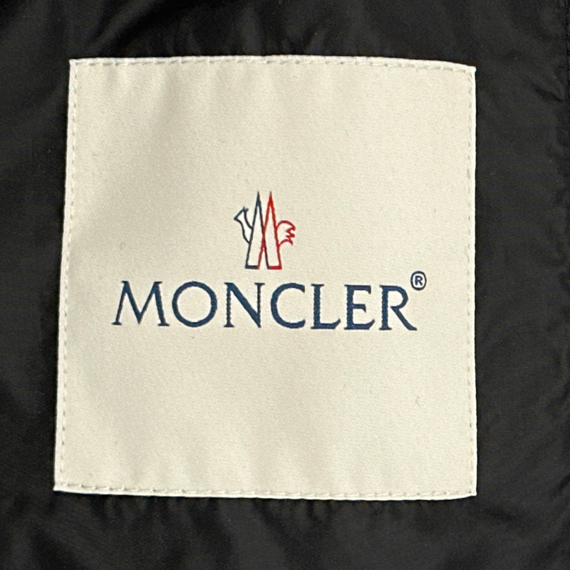 MONCLER women's black and white polyamide oversized rain coat with ruffles and a hoodie