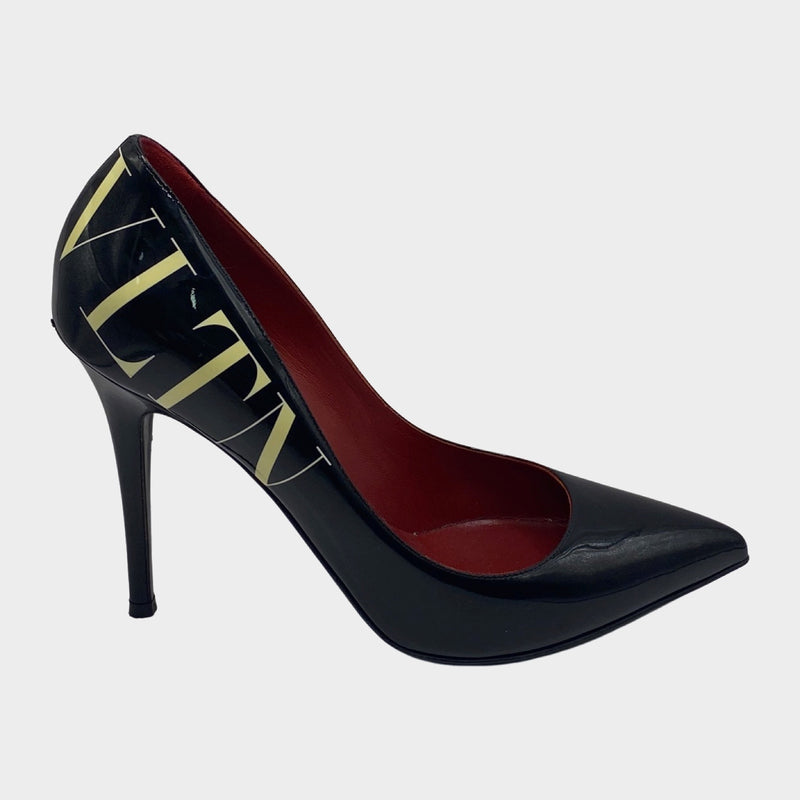 Valentino black patent leather pumps with ecru logo print